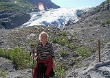 Alaska Trip - Seward - Real Alaska Tour - Exit Glacier Visit - The visit to the glacier started at the Exit Glacier Nature Center. This picture of Lucinda was taken with Exit Glacier in the background. She is carrying my hiking stick / camera monopod. I brought two hiking sticks along on the trip and at the start of the tour I suggested that we bring both but she assured me that she would not use one. As we started the walk up to the glacier she asked to use mine "for a little while" - the rest is obvious. She stayed at a rest area on the path within view of the glacier while I proceeded the rest of the way to the glacier. Alaska Trip - Seward - Real Alaska Tour - Exit Glacier Visit